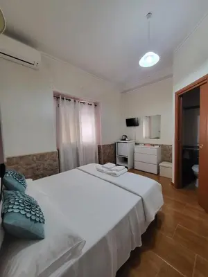 Letto o letti in una camera di B&B Il Girasole