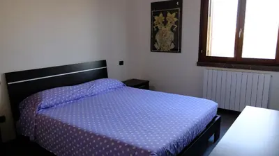 Letto o letti in una camera di La Baia Casa Vacanze