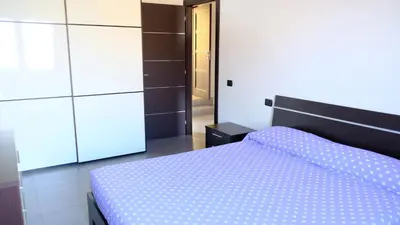 Letto o letti in una camera di La Baia Casa Vacanze