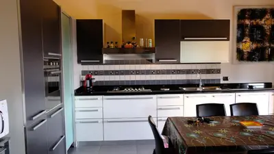 Cucina o angolo cottura di La Baia Casa Vacanze