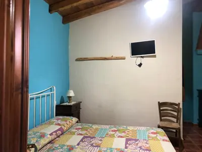 Letto o letti in una camera di Agriturismo Bingia Bonaria