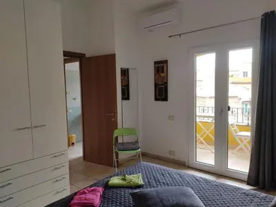 Letto o letti in una camera di Casa Vacanze - Villa San Pietro