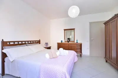 Letto o letti in una camera di IzzHome Regina Margherita