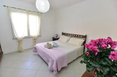 Letto o letti in una camera di IzzHome Regina Margherita