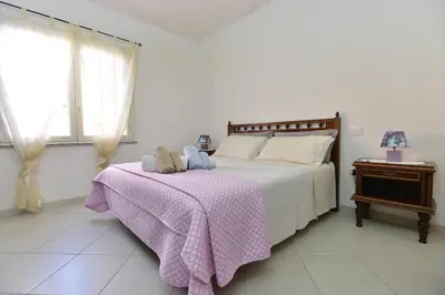 Letto o letti in una camera di IzzHome Regina Margherita