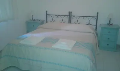 Letto o letti in una camera di B&B S'Archiotta