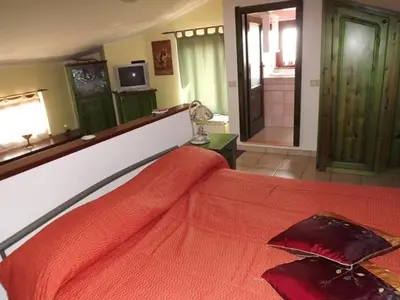 Letto o letti in una camera di Terrazza Sant'Antioco