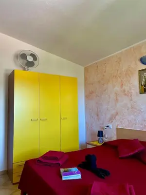 Letto o letti in una camera di Appartamento MareNatura
