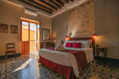 Letto o letti in una camera di Cappuccine GuestHouse