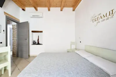 Letto o letti in una camera di Al Vicoletto - Genuine Hospitality & Private Parking