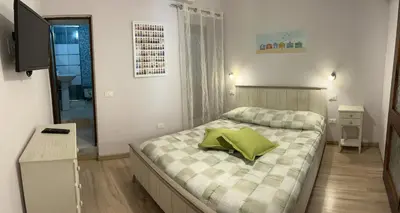 Letto o letti in una camera di Casa Victoria IUN Q5032