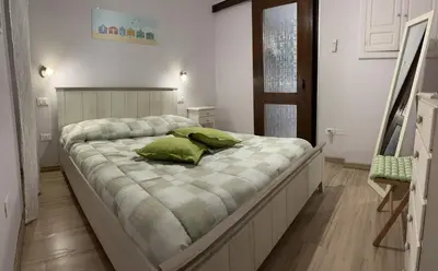 Letto o letti in una camera di Casa Victoria IUN Q5032