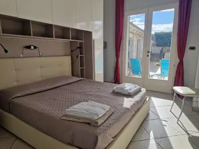 Letto o letti in una camera di Casa Sinzias con piscina 9 posti letto
