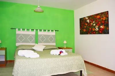 Letto o letti in una camera di Casa Vacanza Porto Frailis già Porto Frailis B&B