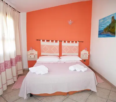 Letto o letti in una camera di Casa Vacanza Porto Frailis già Porto Frailis B&B