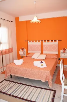 Letto o letti in una camera di Casa Vacanza Porto Frailis già Porto Frailis B&B