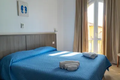 Letto o letti in una camera di MuMA Hostel