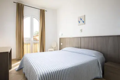 Letto o letti in una camera di MuMA Hostel