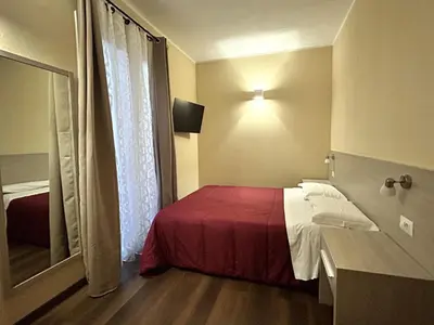 Letto o letti in una camera di Affittacamere In Centro