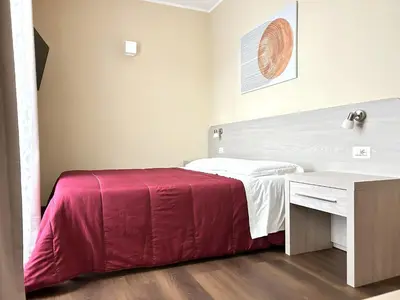 Letto o letti in una camera di Affittacamere In Centro