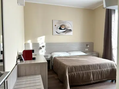 Letto o letti in una camera di Affittacamere In Centro