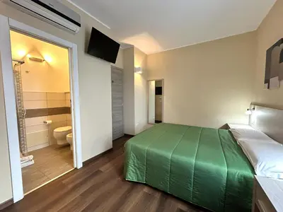 Letto o letti in una camera di Affittacamere In Centro