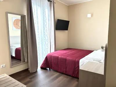 Letto o letti in una camera di Affittacamere In Centro