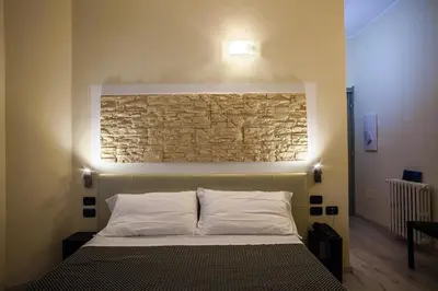 Letto o letti in una camera di Hotel Calamosca
