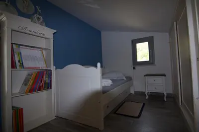 Letto o letti in una camera di La Pazienza