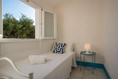 Letto o letti in una camera di Sul Mare Sardegna Villa Eulimene