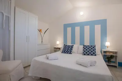 Letto o letti in una camera di Sul Mare Sardegna Villa Eulimene