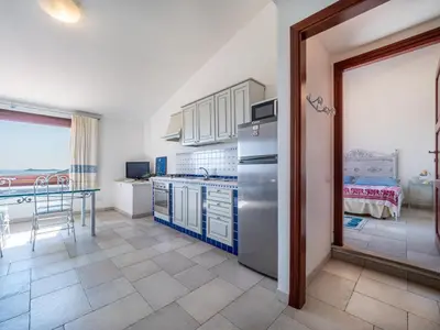 Cucina o angolo cottura di Ollastu Apartments Villasimius