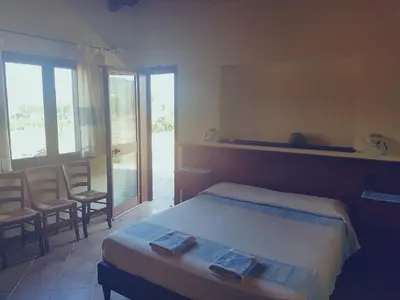 Letto o letti in una camera di B&B Gennemara - Porta del Mare