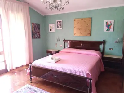Letto o letti in una camera di Villa Corrias
