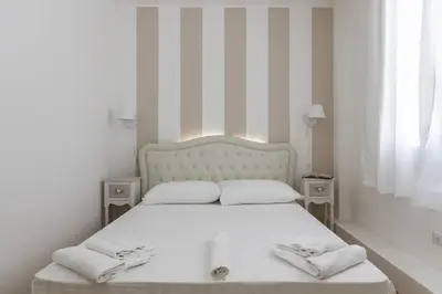 Letto o letti in una camera di Domus Karalis