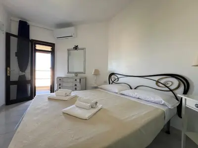 Letto o letti in una camera di Le Palmette