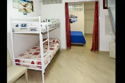 Letto o letti in una camera di B&B Quintino Sella