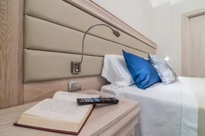 Letto o letti in una camera di L'Ambasciata Hotel de Charme