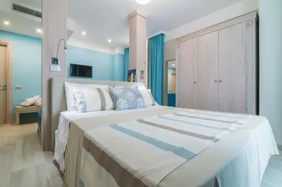 Letto o letti in una camera di L'Ambasciata Hotel de Charme