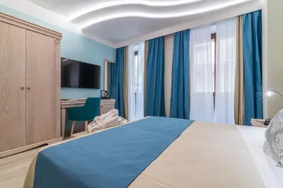 Letto o letti in una camera di L'Ambasciata Hotel de Charme
