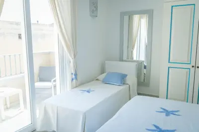 Letto o letti in una camera di Hotel Regina Simius