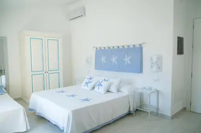 Letto o letti in una camera di Hotel Regina Simius