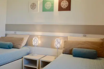 Letto o letti in una camera di Case Sul Mare Residenze Di Bes