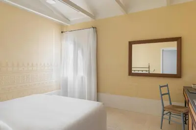 Letto o letti in una camera di Hotel Le Dune Piscinas