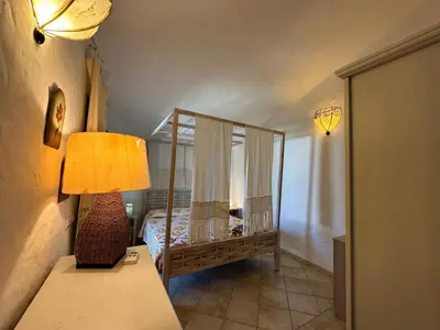 Letto o letti in una camera di Villetta Calasetta intera casa vacanze