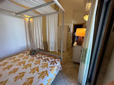 Letto o letti in una camera di Villetta Calasetta intera casa vacanze
