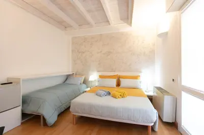 Letto o letti in una camera di Giardini e Mare