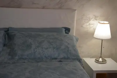 Letto o letti in una camera di Giardini e Mare