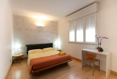 Letto o letti in una camera di Giardini e Mare