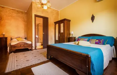 Letto o letti in una camera di Su Connotu